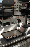 custom cutout for a material handling stainless steel workbench