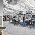 Engineers using ESD-safe electronics workstations