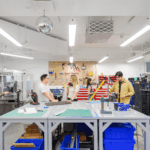 Engineering fabrication workshop with heavy-duty workbenches