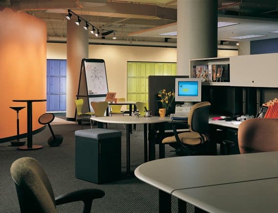 Collaboration circa 1996 at Autodesk/Kinetix building in San Francisco at the beginning of the dot-com boom. Note blue and green lockers built into far wall for teleworkers coming into the office, and the "rocker" bar stools which encourage impromptu meetings-- just don't linger too long. Architect HOK, interiors Millican/Jones.